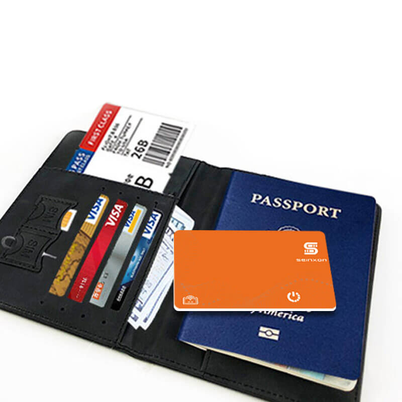 A-grey-Passport-holder-with-the-small-tracking-device-for-wallet